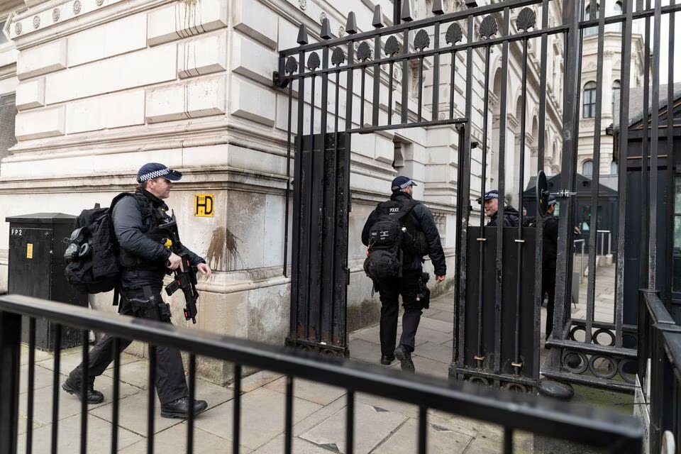 Police officers walk towards Downing Street, in London, Britain on February 12, 2022. File Photo / Reuters
