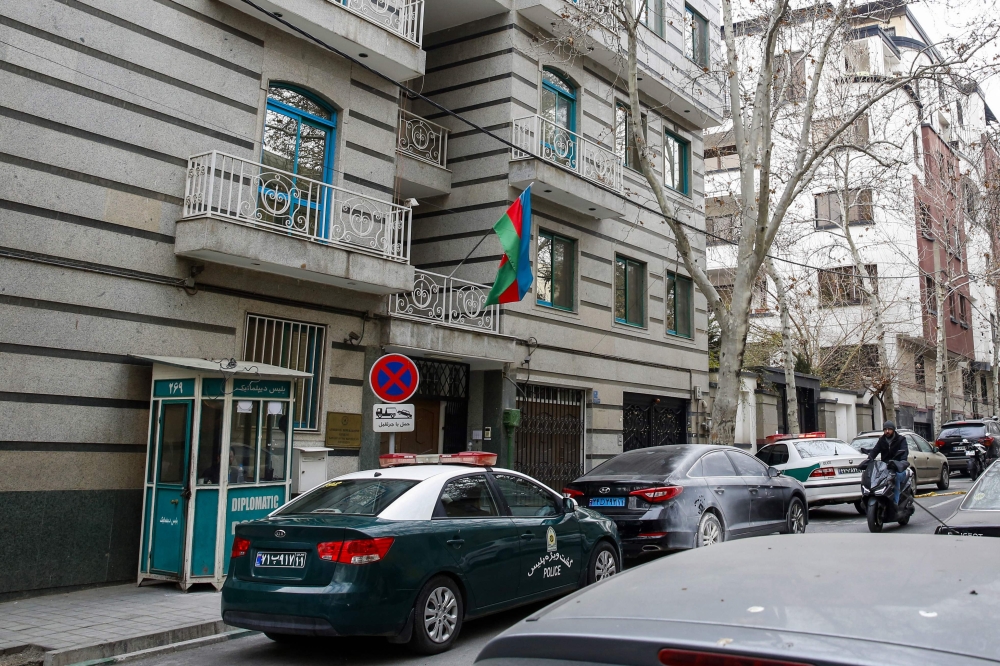 Police stay guard in front of the Azerbaijan embassy in Tehran on January 27, 2023, following an attack. Photo by AFP