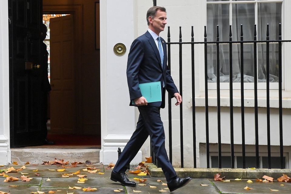 Britain's Chancellor of the Exchequer Jeremy Hunt walks at Downing Street in London, Britain, November 17, 2022. REUTERS/Toby Melville