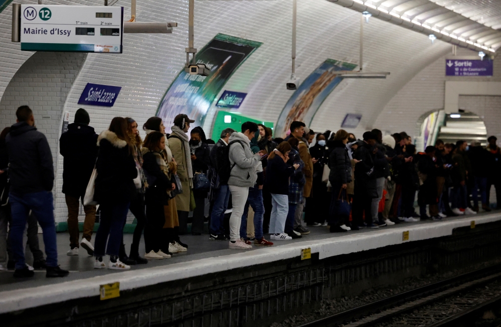 Passengers stand on a platform during a strike by Paris transport network (RATP) workers at Saint-Lazare metro station in Paris as part of a nationwide day of strike and protests against French government's pension reform plan in France, January 31, 2023. Reuters/Sarah Meyssonnier