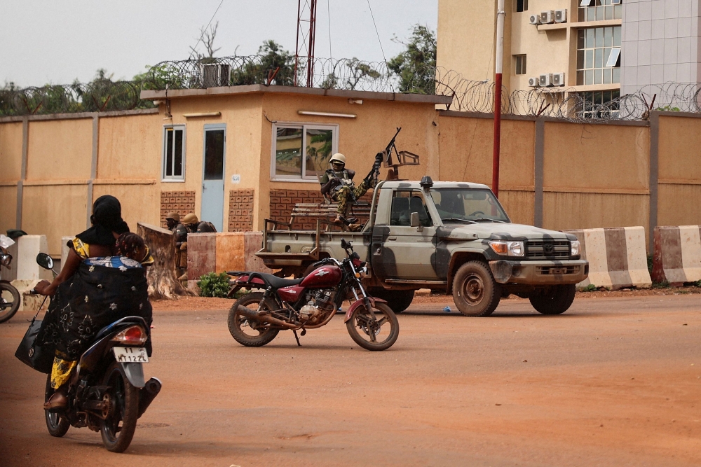 In this file photo taken on September 30, 2022 Burkina Faso soldiers are seen deployed in Ouagadougou. - An attack by suspected jihadists in northern Burkina Faso has killed 13 people, including 10 military police, the army said on January 31, 2023. (Photo by Olympia DE MAISMONT / AFP)