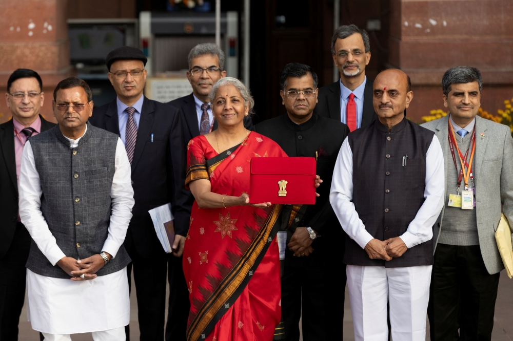 India's Finance Minister Nirmala Sitharaman holds up a folder with the Government of India's logo as she leaves her office to present the federal budget in the parliament, in New Delhi, India, February 1, 2023. Reuters/Adnan Abidi