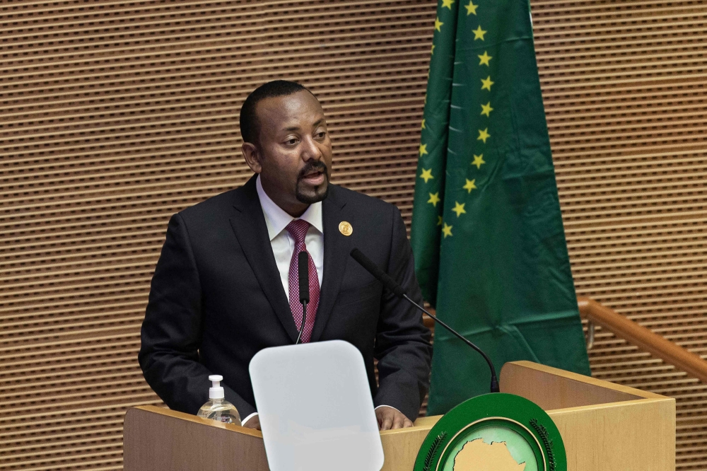In this file photo taken on February 05, 2022 Ethiopia's Prime Minister Abiy Ahmed speaks during the 35th Ordinary Session of the African Union (AU) Summit in Addis Ababa, Ethiopia. - Ethiopian Prime Minister Abiy Ahmed and other government officials on February 3, 2023 held their first meeting with Tigrayan leaders since a November peace deal, state media reported.
