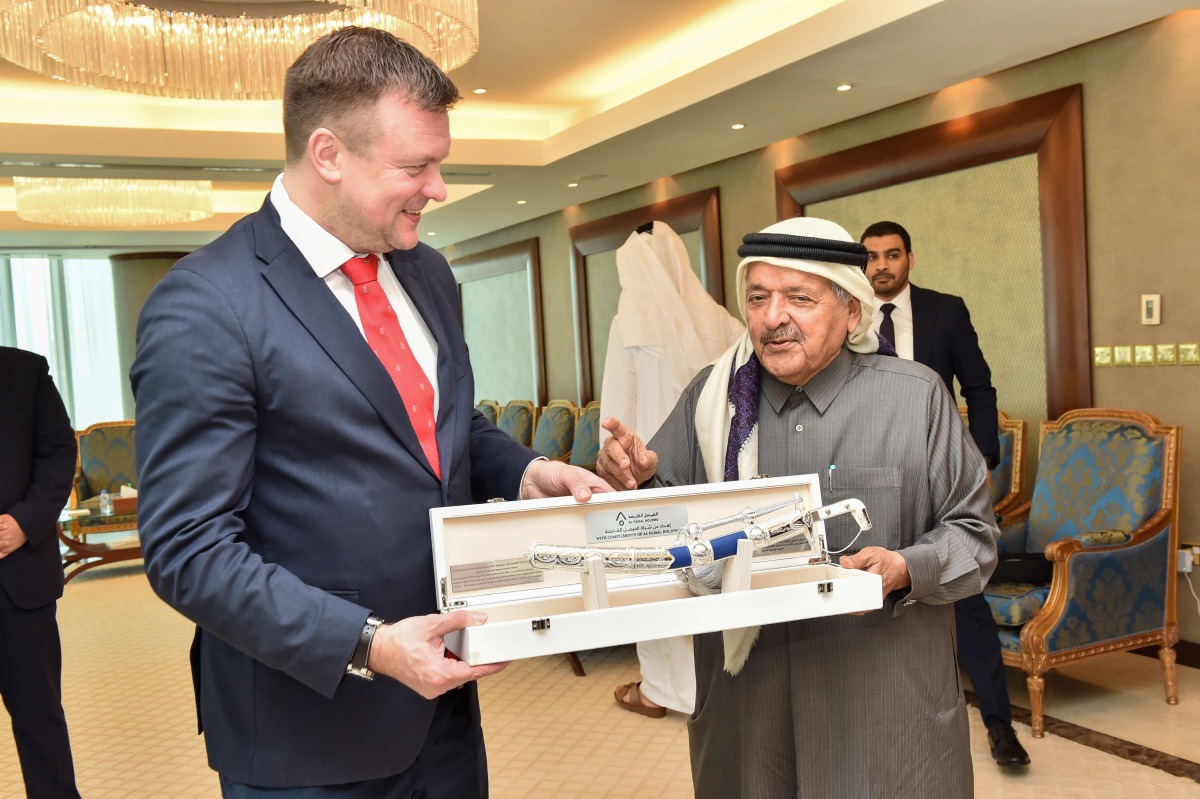Sheikh Faisal bin Qassim Al Thani, QBA Chairman exchanges a memento with Minister of Development Cooperation and Foreign Trade of the Republic of Finland, H E Ville Skinnari.
