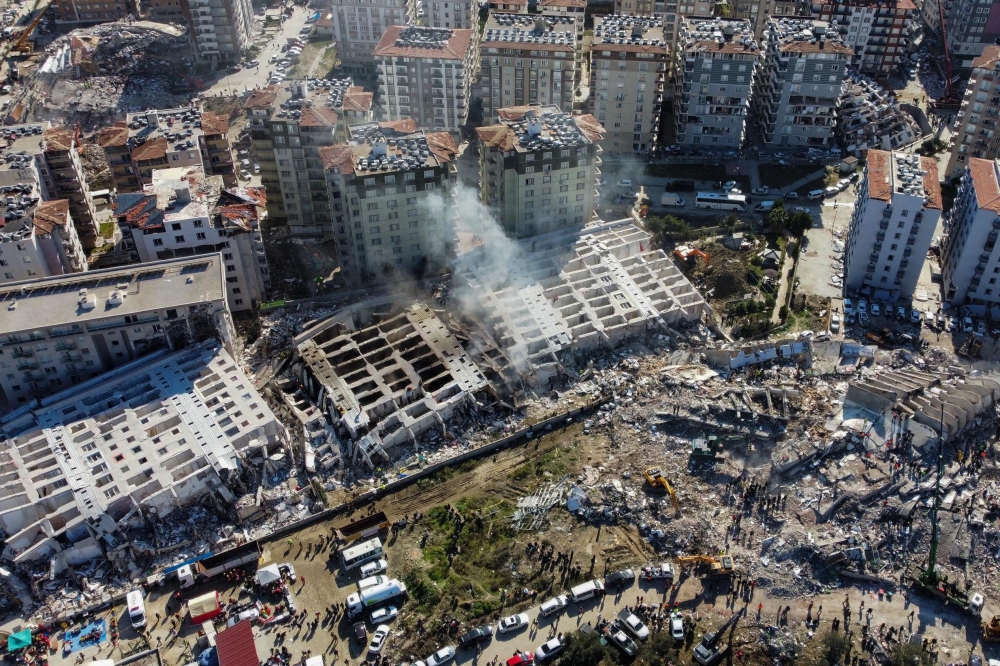 This aerial view shows collapsed buildings in Hatay, southeastern Turkey, on February 8, 2023, two days after a strong earthquake struck the region. Photo by DHA (Demiroren News Agency) / AFP)