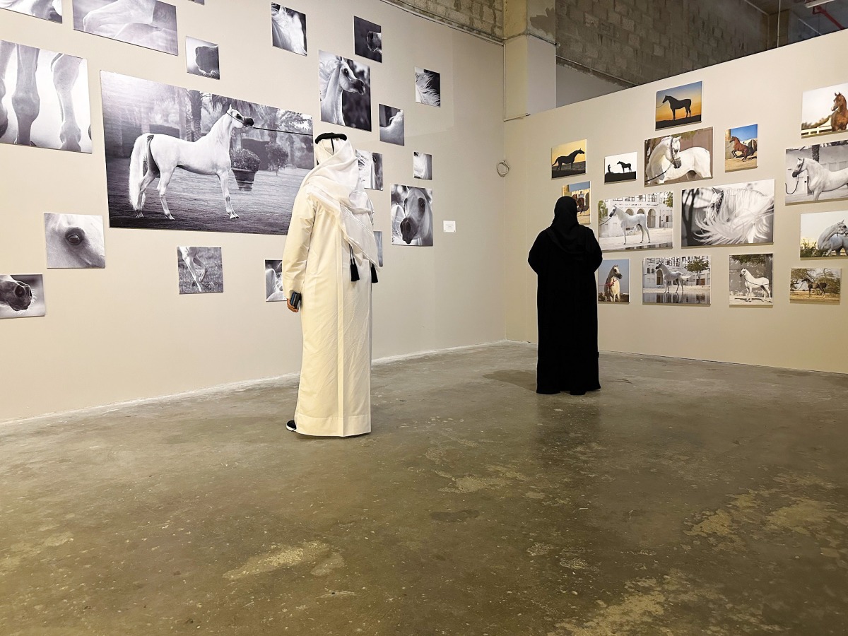 Visitors touring art exhibition “Horse Month” at Msheireb Downtown Doha. 