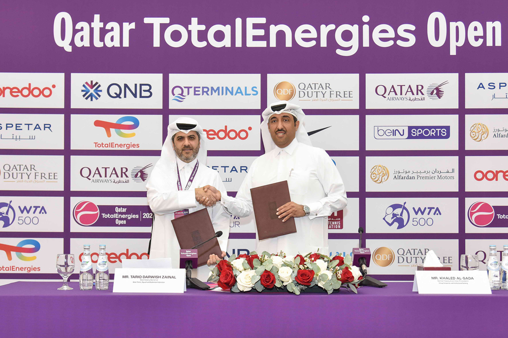 Qatar Tennis, Squash and Badminton Federation Secretary-General Tariq Zainal and QNB's Group Corporate and Institutional Banking Senior Executive Vice President Khaled Al Sada shake hands after signing the sponsorship agreement.