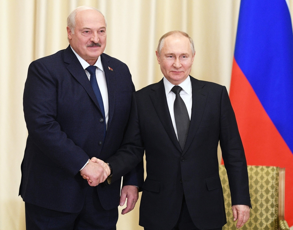 Russian President Vladimir Putin (right) meets with his Belarusian counterpart Alexander Lukashenko at the Novo-Ogaryovo state residence, outside Moscow, on February 17, 2023. (Photo by Vladimir Astapkovich / Sputnik / AFP)