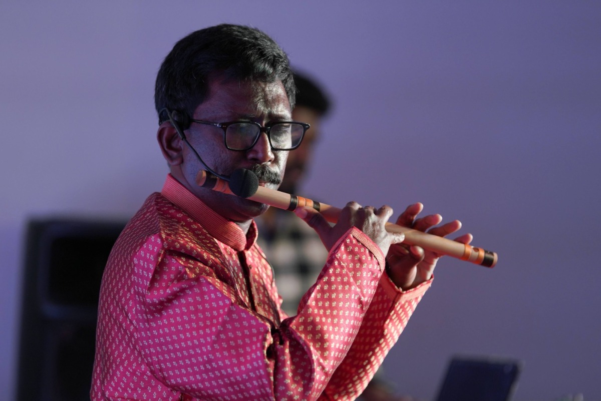 Flutist Saji Manjamala performing at the cultural event 