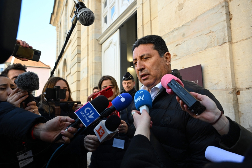 Humberto Zepeda, the father of Nicolas Zepeda, a Chilean man accused of allegedly murdering his Japanese ex-girlfriend Narumi Kurosaki, speaks to journalists outside the Vesoul courthouse on the first day of Nicolas Zepeda's appeal trial in Vesoul, eastern France, on February 21, 2023. - The appeal trial has been postponed to February 23 after Nicolas Zepeda changed his defense attorney. (Photo by Sébastien BOZON / AFP)
 