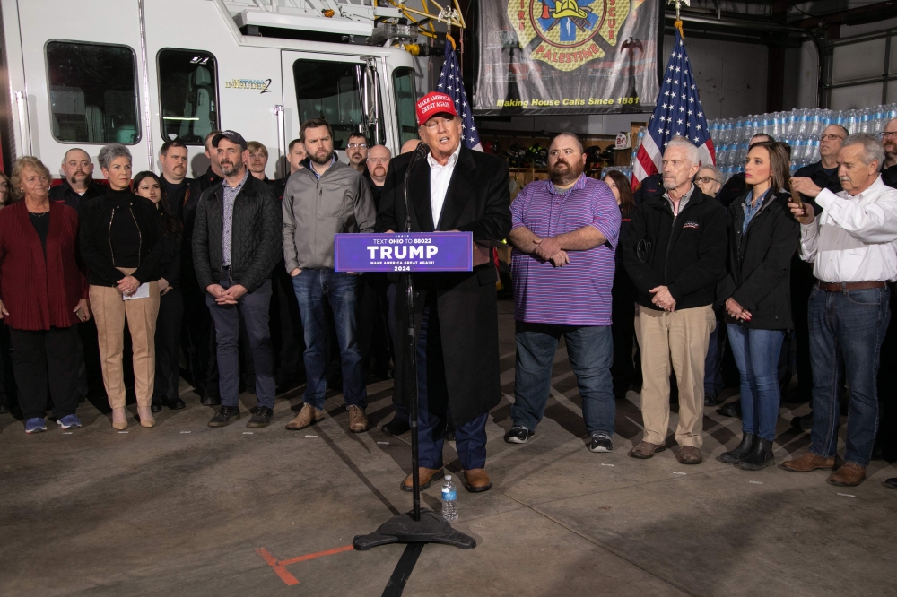 Former US President Donald Trump speaks at the East Palestine Fire Department in East Palestine, Ohio, on February 22, 2023.  (Photo by Rebecca DROKE / AFP)
