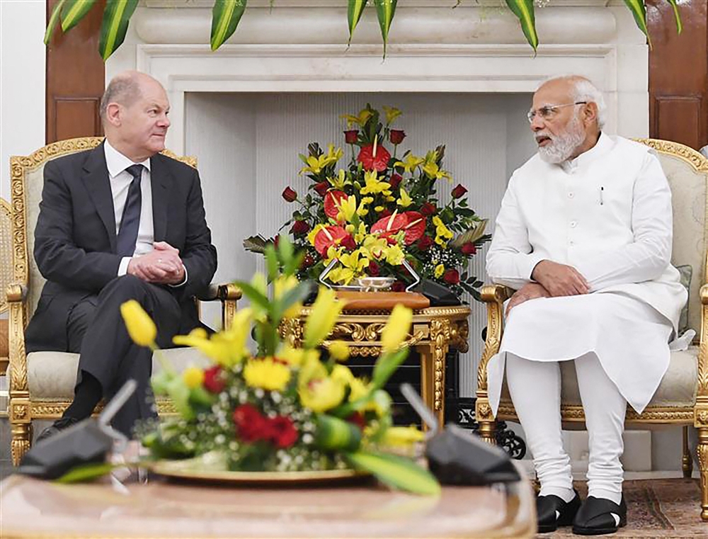 This handout photo taken and released by Indian Press Information Bureau (PIB) on February 25, 2023 shows India's Prime Minister Narendra Modi meeting with German Chancellor Olaf Scholz in New Delhi. (Photo by PIB / AFP) 