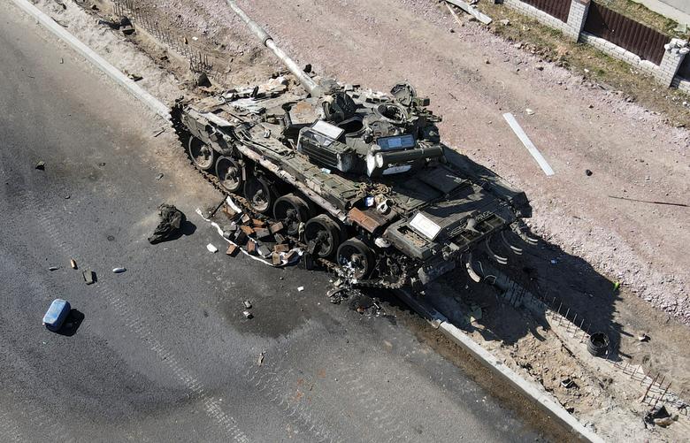 File Photo: A charred Russian tank is seen on the front line in the Kyiv region, Ukraine March 20, 2022. (Ukrainian Ground Forces/via REUTERS)