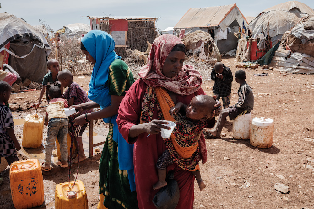 A mother gives water to her child at a camp for displaced persons in Baidoa, Somalia. Hungry people are heading to Baidoa from rural areas of southern Somalia, one of the regions hardest hit by drought. File photo / AFP