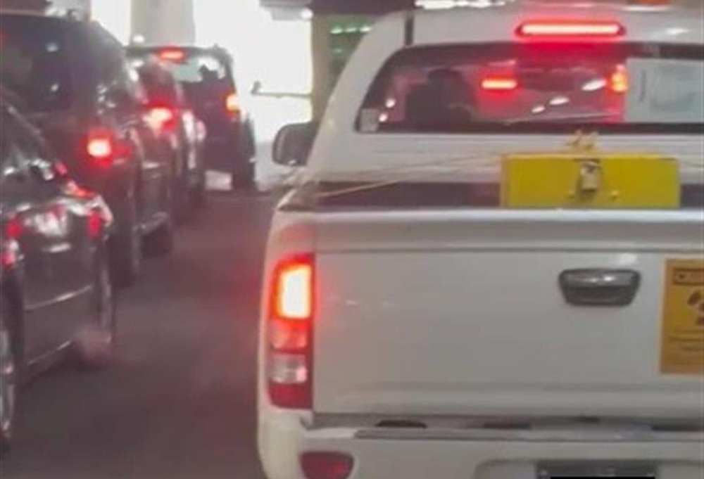 File photo: Vehicle with the radioactive warning symbol sticker in traffic.