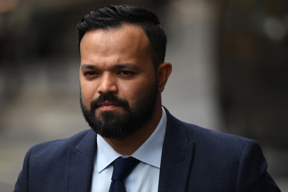 Former cricket player Azeem Rafiq arrives to attend a Cricket Discipline Commission hearing, relating to allegations of racism at Yorkshire County Cricket Club, in London on March 1, 2023. - A Cricket Discipline Commission hearing starts in London today but no Yorkshire representatives will be present after they admitted to four amended charges brought by the England and Wales Cricket Board over the club's handling of former player Azeem Rafiq's allegations. (Photo by Daniel LEAL / AFP)