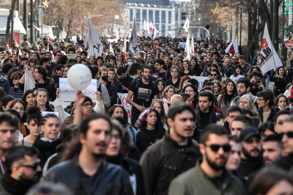 Protesters march during a demonstration of students and pupils in central Athens on March 3, 2023, following a deadly train accident near the city of Larissa, where at least 57 people, most of them students, lost their lives. (Photo by Louisa Gouliamaki / AFP)