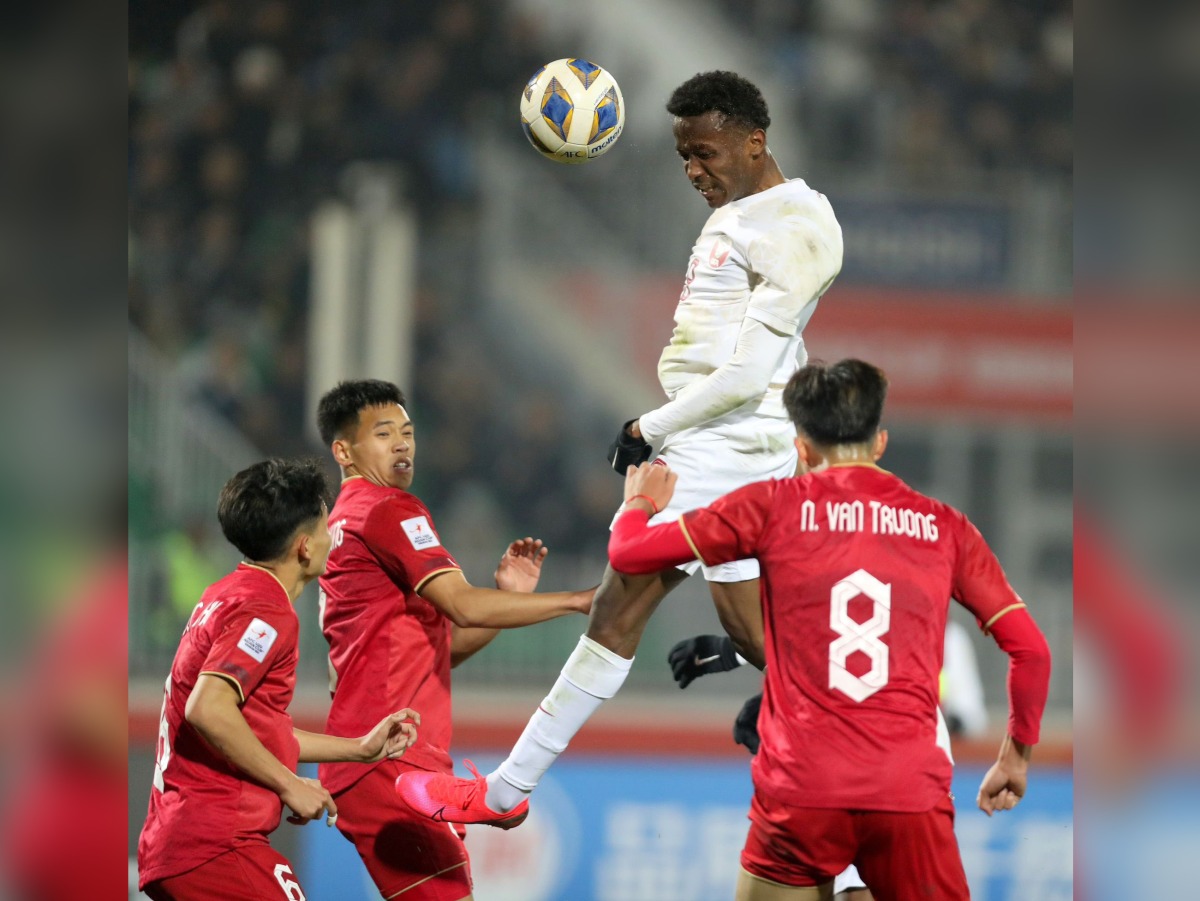 Action during the match between Qatar and Vietnam yesterday.