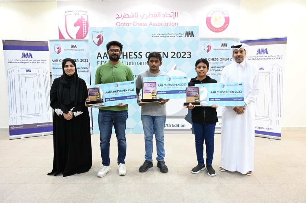 QCA President Mohamed Al Mudahka and AAB Government Relations and Public Affairs Director Dr. Eiman Al Ansari pose with the winners.  