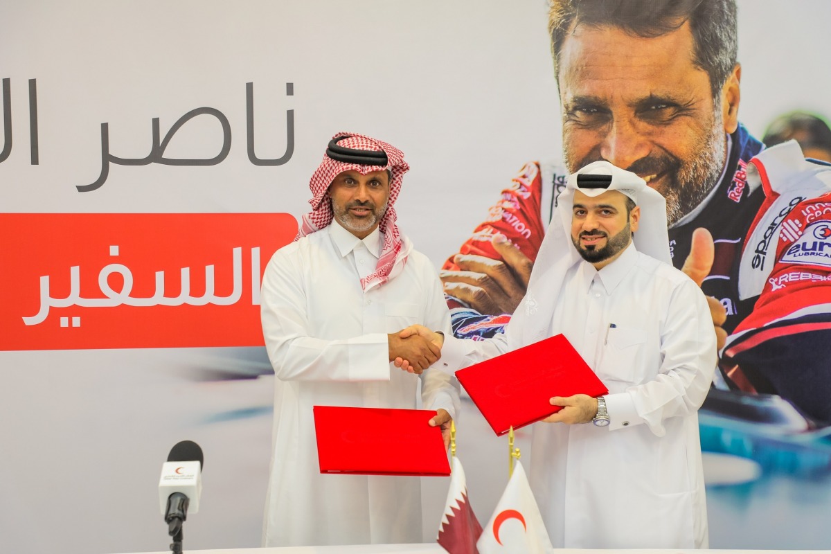 Nasser Al Attiyah and Faisal Mohamed Al Emadi, Acting Secretary-General of QRCS at the agreement signing ceremony.