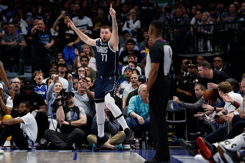 DALLAS, TEXAS - MARCH 22: Luka Doncic #77 of the Dallas Mavericks reacts after a call in the second half against the Golden State Warriors at American Airlines Center on March 22, 2023 in Dallas, Texas.