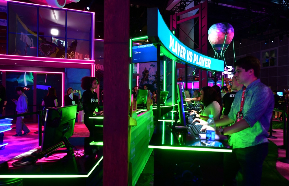 In this file photo taken on June 11, 2019 Gaming fans play 