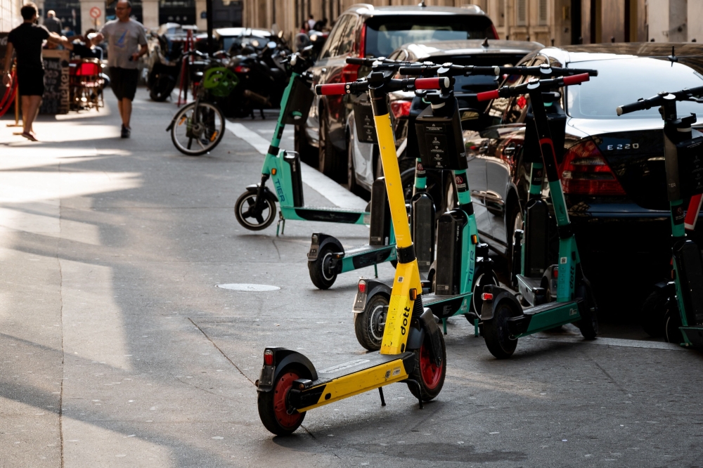 In this file photo taken on September, 2021, free floating rental electric scooters are seen on a sidewalk in Paris. Photo by AFP