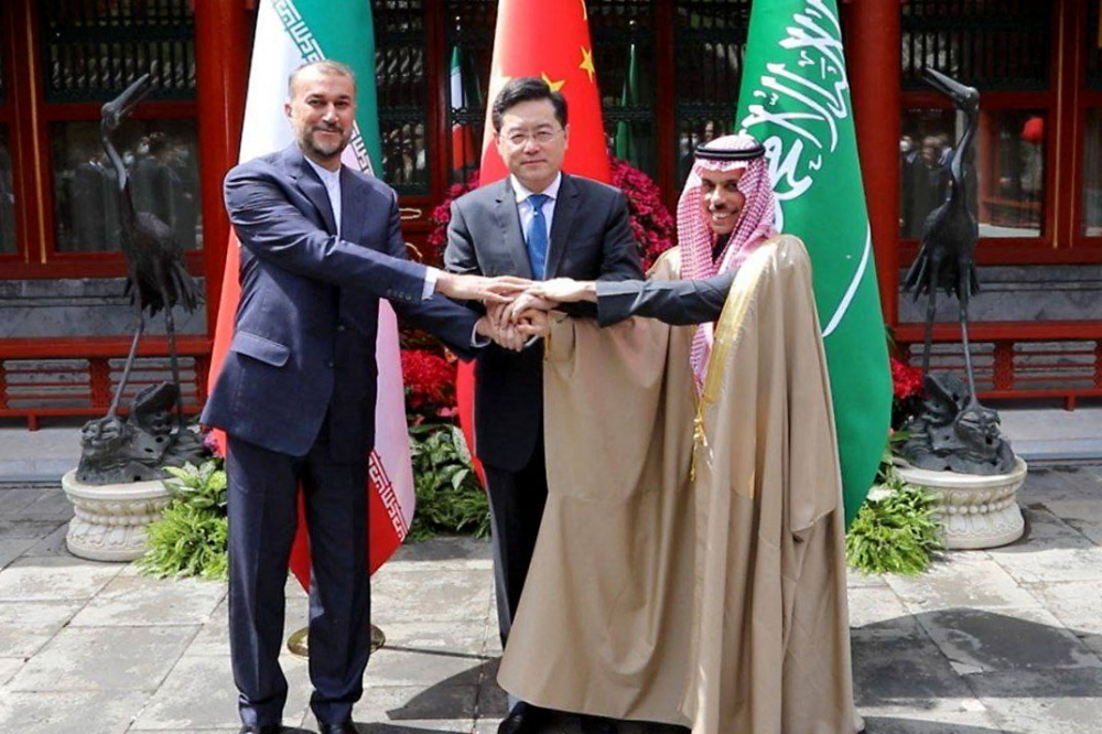 This handout picture provided by the Iranian foreign ministry shows Iran's Foreign Minister Hossein Amir-Abdollahian (L) shaking hands with Saudi Foreign Affairs Minister Prince Faisal bin Farhan and Chinese Foreign Minister Qin Gang (C) during a meeting in Beijing on April 6, 2023. (Photo by Iranian Foreign Ministry / AFP)