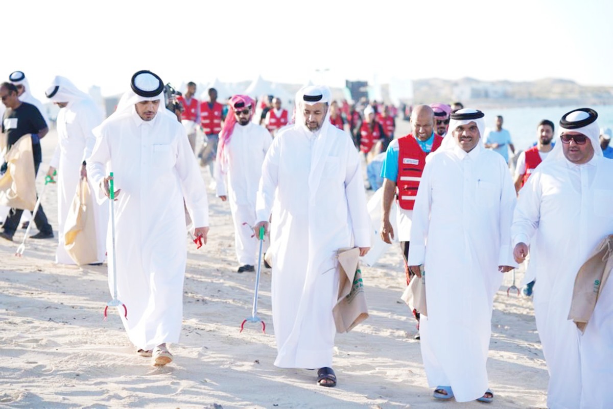 Minister of Environment and Climate Change H E Sheikh Dr. Faleh bin Nasser bin Ahmed bin Ali Al Thani (third right) and other officials during a beach clean-up, at Fuwairit Beach. 