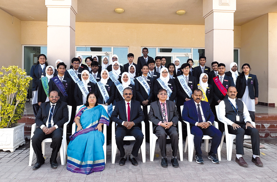 The school officials with the newly elected student council members.