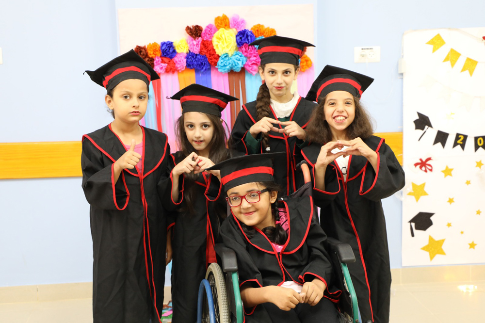 Graduates of the Early Childhood Department of the Hamad Bin Jassim Center for Integrated Rehabilitation Care in the Gaza Strip.