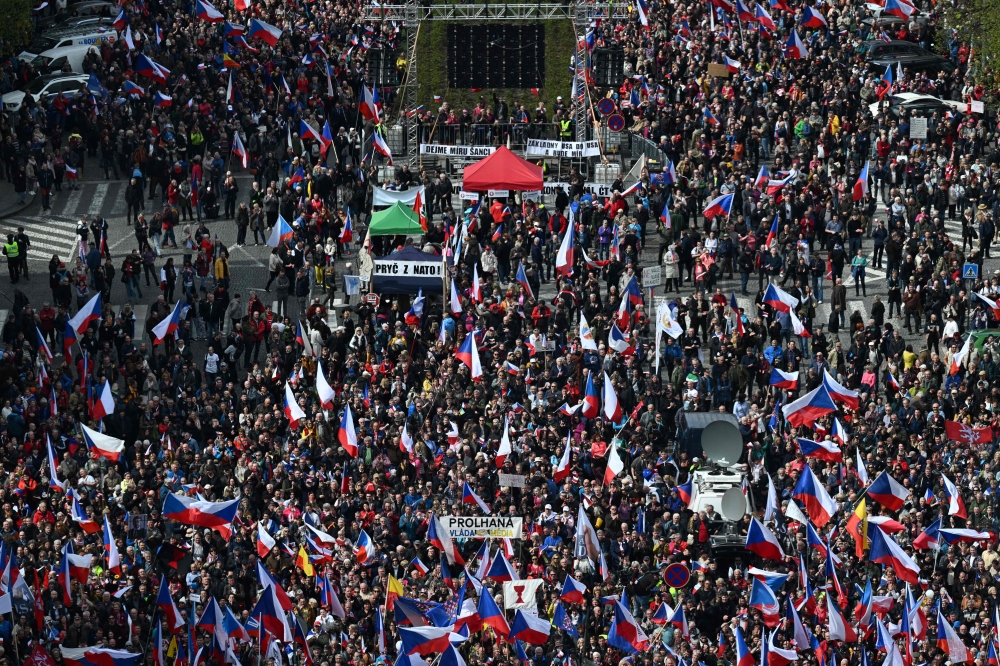People take part in an anti-governmental demonstration in Prague on April 16, 2023. - Thousands of people rallied against the Czech government in Prague at an event called 