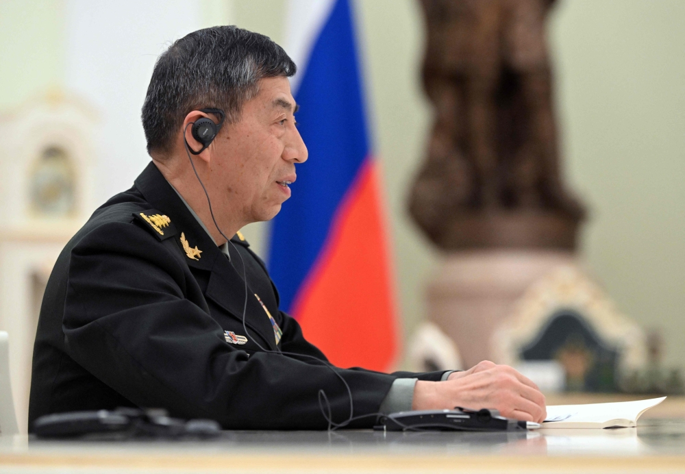 Chinese Defence Minister Li Shangfu attends a meeting with Russian President at the Kremlin in Moscow on April 16, 2023. (Photo by Pavel Bednnyakov / SPUTNIK / AFP)