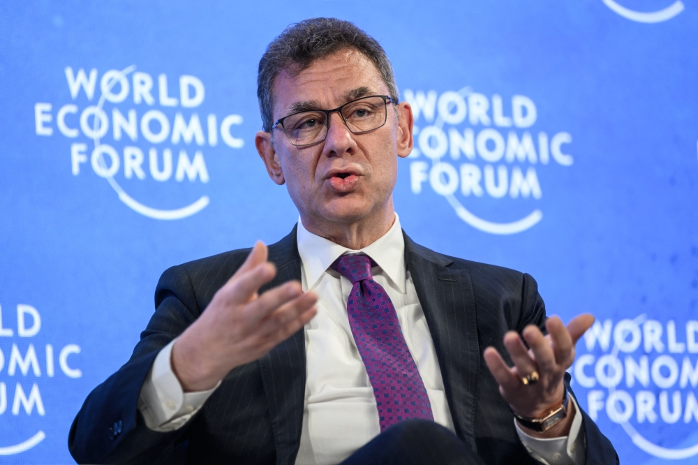 In this file photo taken on May 25, 2022 US pharmaceutical giant Pfizer CEO Albert Bourla gestures during a session at the World Economic Forum (WEF) annual meeting in Davos. (Photo by Fabrice Coffrini / AFP)