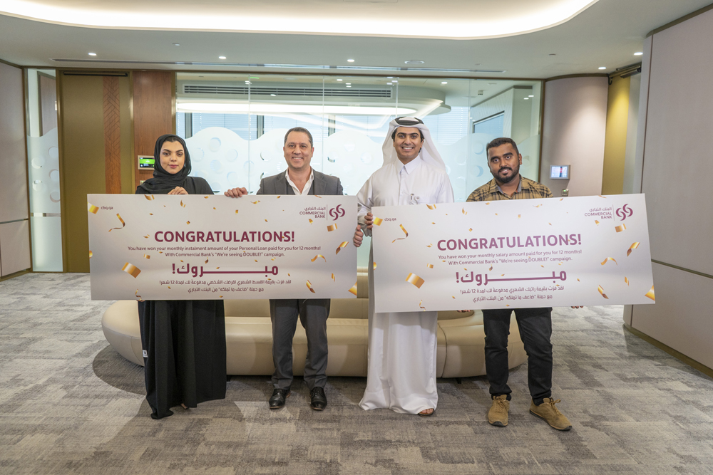 The winners of the 'We’re Seeing Double' campaign pose with officials.
