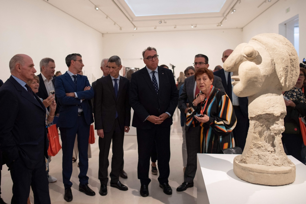 Grand-son of Pablo Picasso, Bernard Ruiz-Picasso (left) and Art Curator Carmen Gimenez, during the inauguration of the 'Picasso Escultor. Materia y Cuerpo' exhibition at the Picasso Museum in Malaga on May 8, 2023. (Photo by JORGE GUERRERO / AFP) 