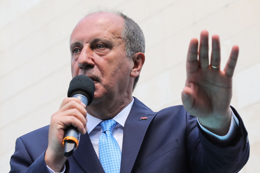 File photo: Chairman and founder of the Turkish centre-left party Memleket (Homeland Party) Muharrem Ince gestures as he delivers a speech on stage during a political rally to launch this new party Memleket, in front of the party headquarters, in Ankara, on May 18, 2021. (Photo by Adem Altan / AFP)