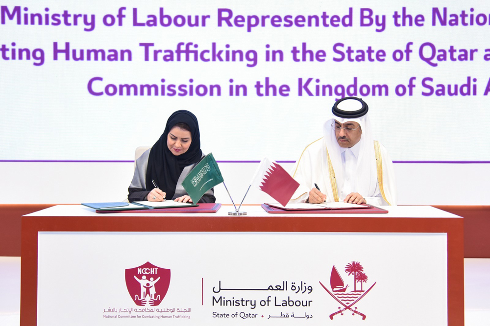Minister of Labour H E Dr. Ali bin Smaikh Al Marri (right) and Chairman of Human Rights Commission of Saudi Arabia and Chair of the Committee to Combat Crimes of Trafficking in Persons H E Dr. Hala bint Mazyed Al Tuwaijri signing an MoU for cooperation in the field of combating human trafficking, in Doha, yesterday.