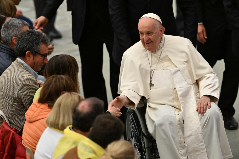 Pope Francis meets with pilgrims from the diocese of Spoleto-Norcia, on May 20, 2023 during an audience at Paul-VI hall in The Vatican. (Photo by Tiziana Fabi / AFP)