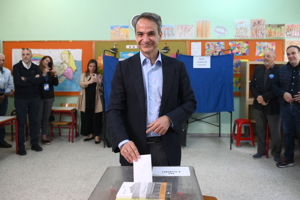 Greek Prime Minister and leader of right wing party New Democracy, Kyriakos Mitsotakis casts his ballot at a polling station during the general election in Athens on May 21, 2023. (Photo by Angelos Tzortzinis / AFP)