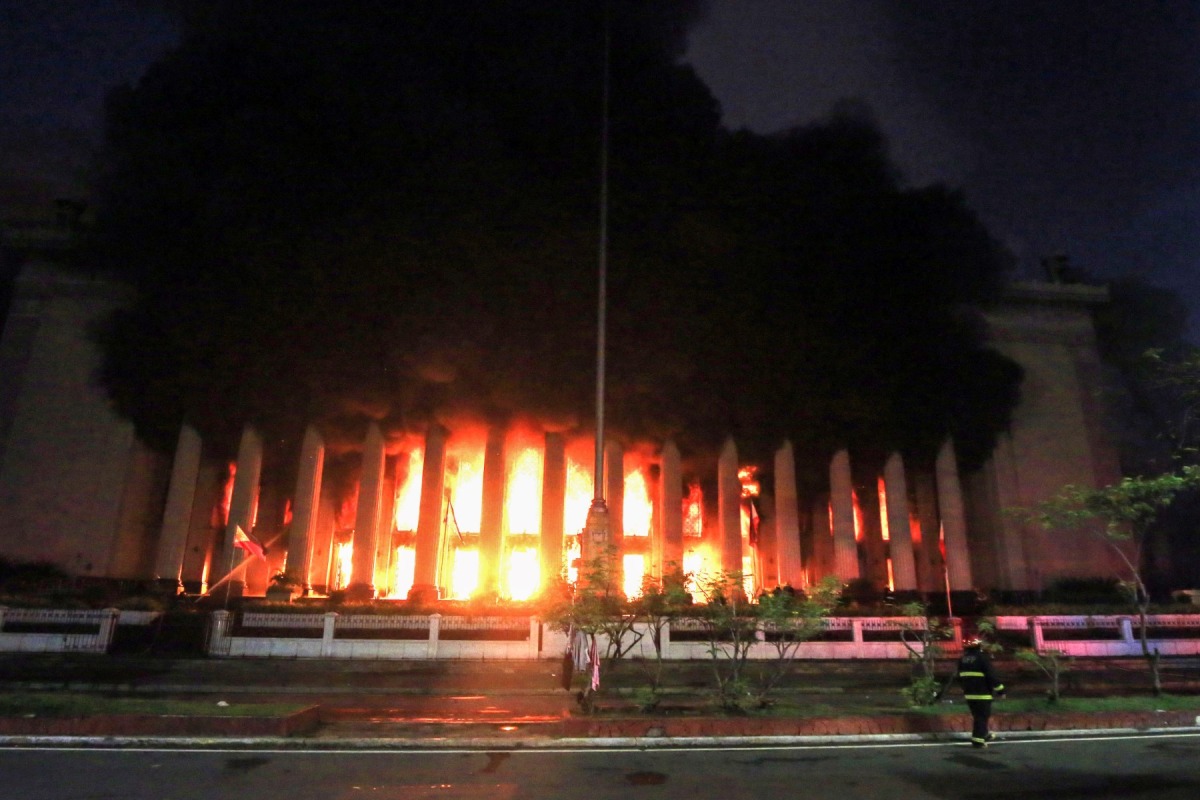 Firefighters douse a fire at the Post Office building in Manila on May 22, 2023. (Photo by AFP)
