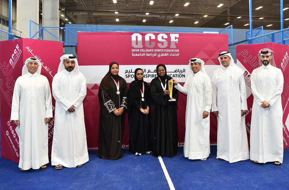 Dr. Ibrahim bin Saleh Al Nuaimi, Undersecretary of the Ministry of Education and Higher Education honouring a winning student at the ceremony.
