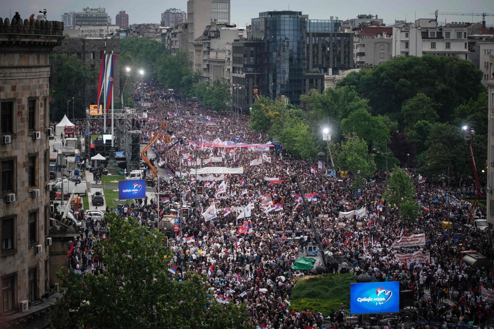 Supporters of Serbian president take part in a pro-government rally in Belgrade, on May 26, 2023. (Photo by Oliver Bunic / AFP)