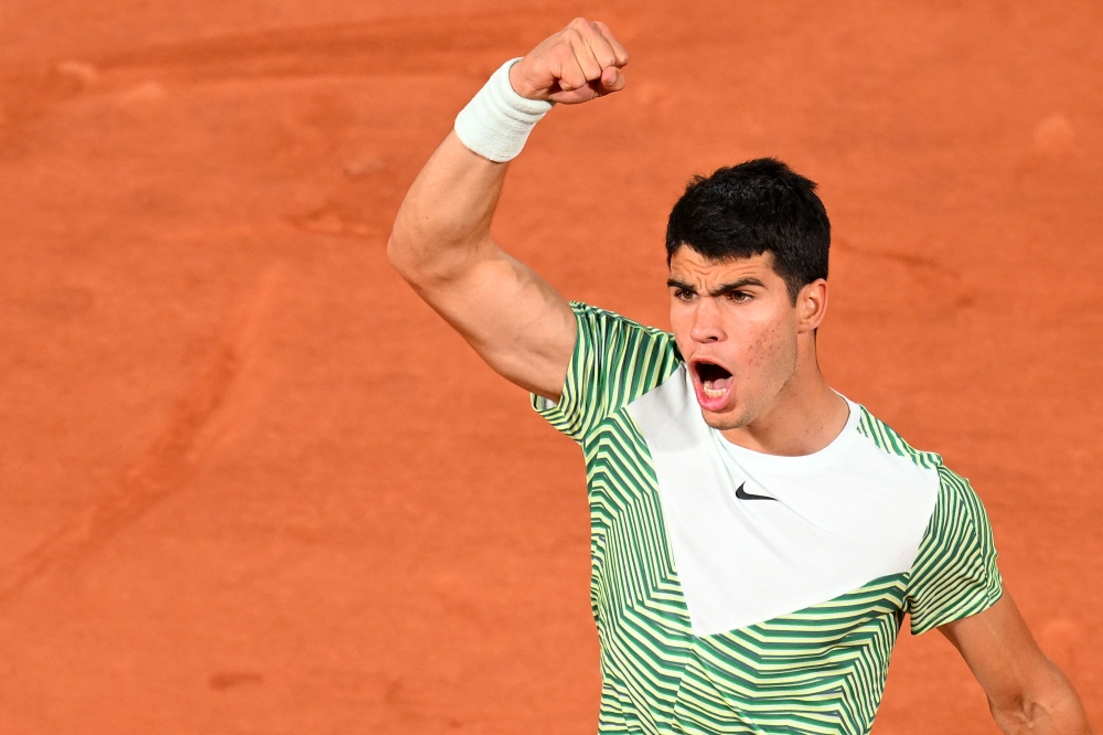 Spain's Carlos Alcaraz Garcia celebrates a point against Greece's Stefanos Tsitsipas during their men's singles quarter final match on day ten of the Roland-Garros Open tennis tournament at the Court Philippe-Chatrier in Paris on June 6, 2023. Photo by Emmanuel DUNAND / AFP