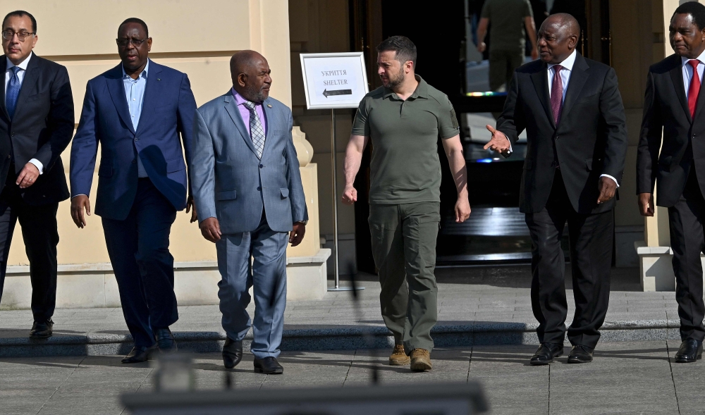 (From left) Egypt's Prime Minister Mostafa Madbouly, Senegal's President Macky Sall, Comoros President Azali Assoumani, Ukraine's President Volodymyr Zelensky, South Africa's President Cyril Ramaphosa and Zambia's President Hakainde Hichilema walk after their talks in Kyiv on June 16, 2023. (Photo by Sergei Supinsky / AFP)