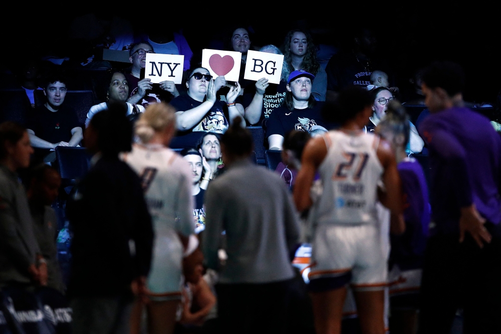 Fans hold up signs in support of Brittney Griner of the Phoenix Mercury during the first half against the New York Liberty at Barclays Center on June 18, 2023 in the Brooklyn borough of New York City. (Photo by Sarah Stier / Getty Images NA via AFP)