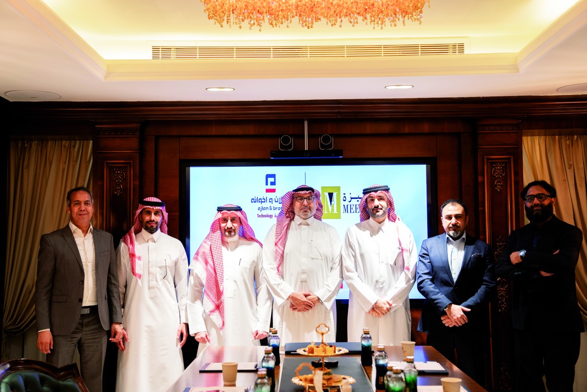 MEEZA and Ajlan Tech officials at the partnership event.