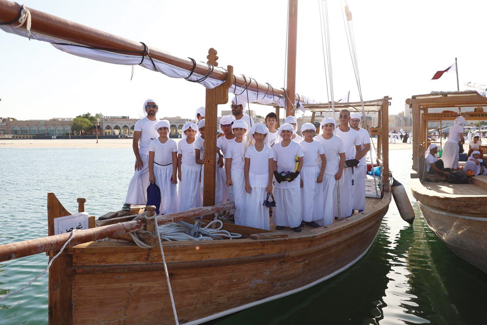 Some of the participants in the fifth edition of the Al Mina Pearl Diving competition for children, which started yesterday at the Katara Beach.