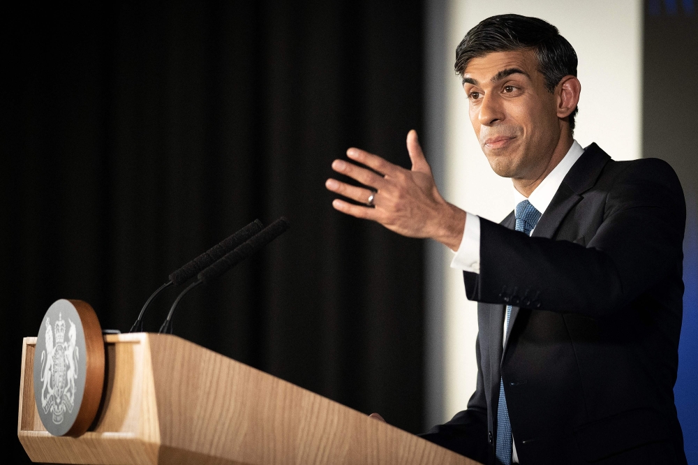 File photo: Britain's Prime Minister Rishi Sunak delivers his first major domestic speech of 2023, at Plexal, Queen Elizabeth Olympic Park in east London, on January 4, 2023. (Photo by Stefan Rousseau / POOL / AFP)

