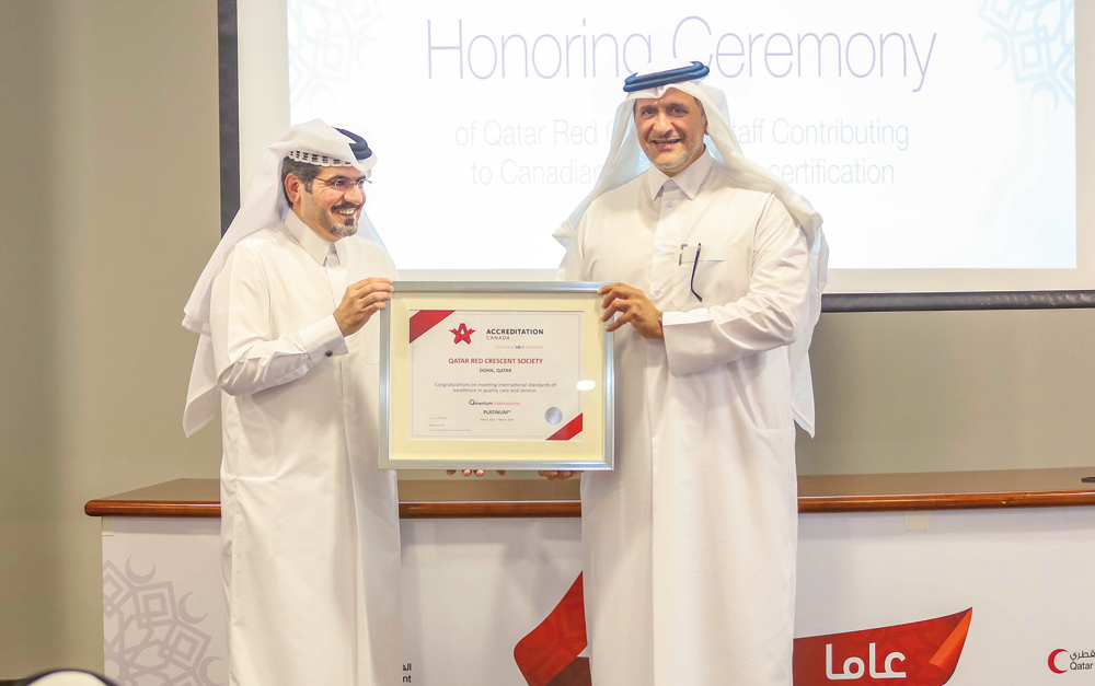 QRCS officials with the accreditation certificate during the event.